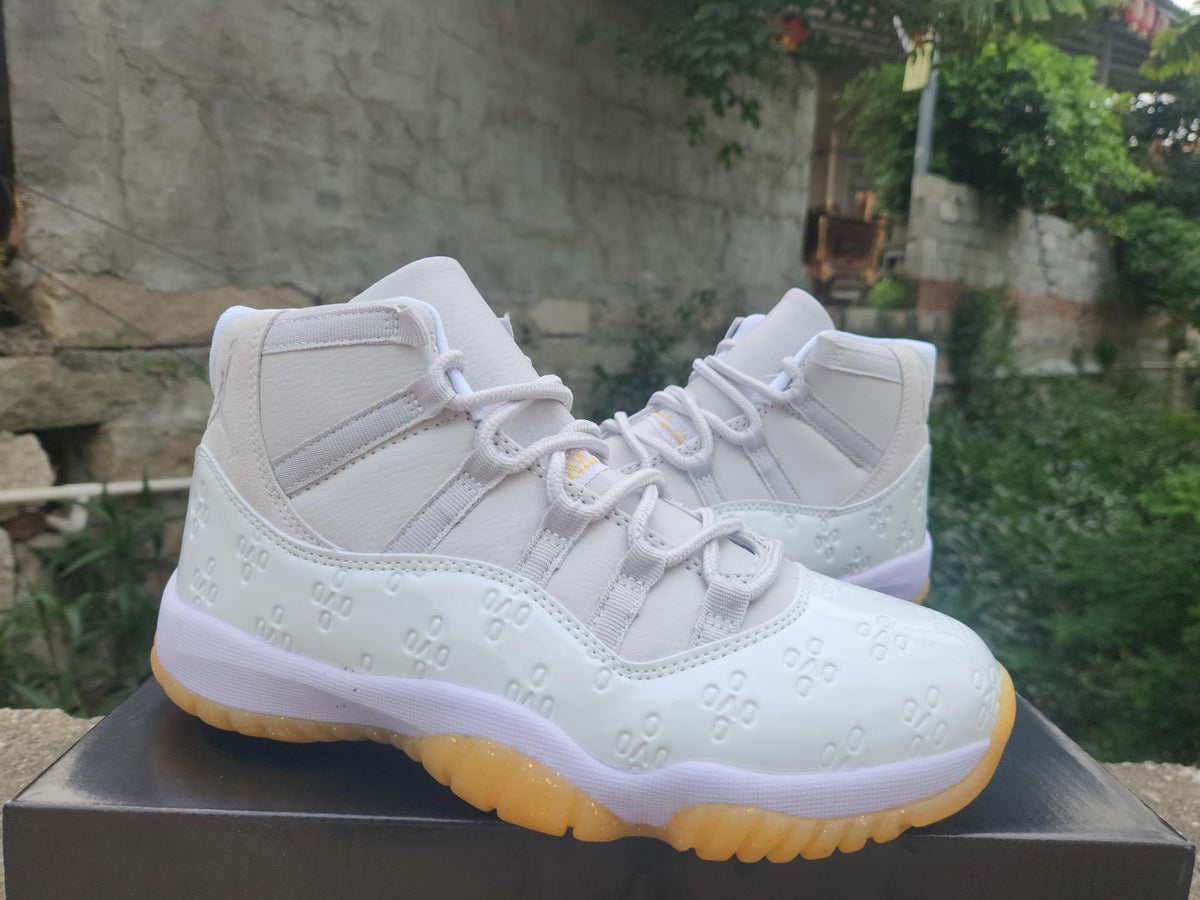 Air Jordan 11 Retro White & Light Yellow High-Top Sneakers