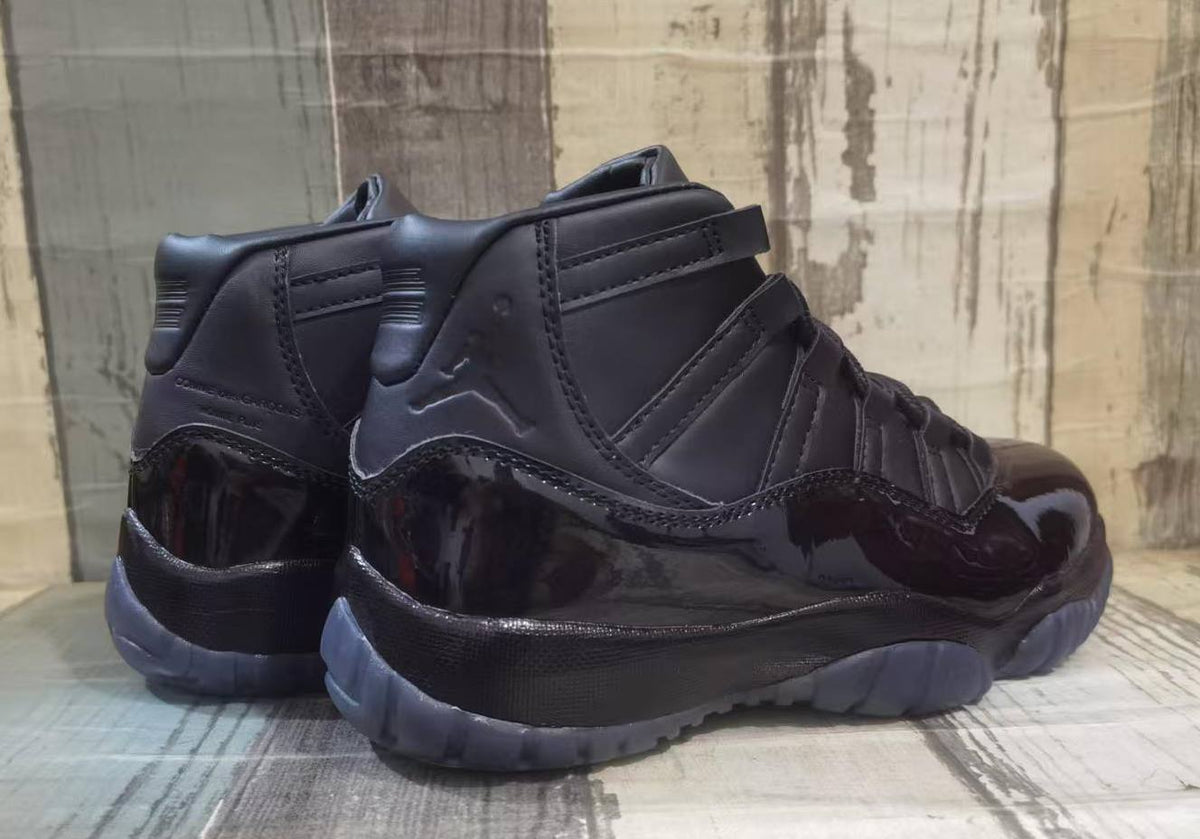 Air Jordan 11 Black High-Top Sneakers with Glossy Overlays