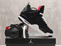 Air Jordan 4 Black & White Sneakers with Red Accents