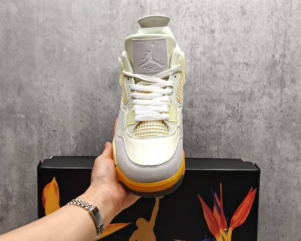 Air Jordan 4 Cream & Grey Sneakers with Orange Accents
