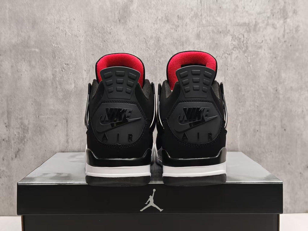 Air Jordan 4 Black & White Sneakers with Red Accents