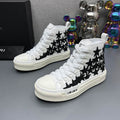 AMIRI White High-Top Sneakers with Black Star Details