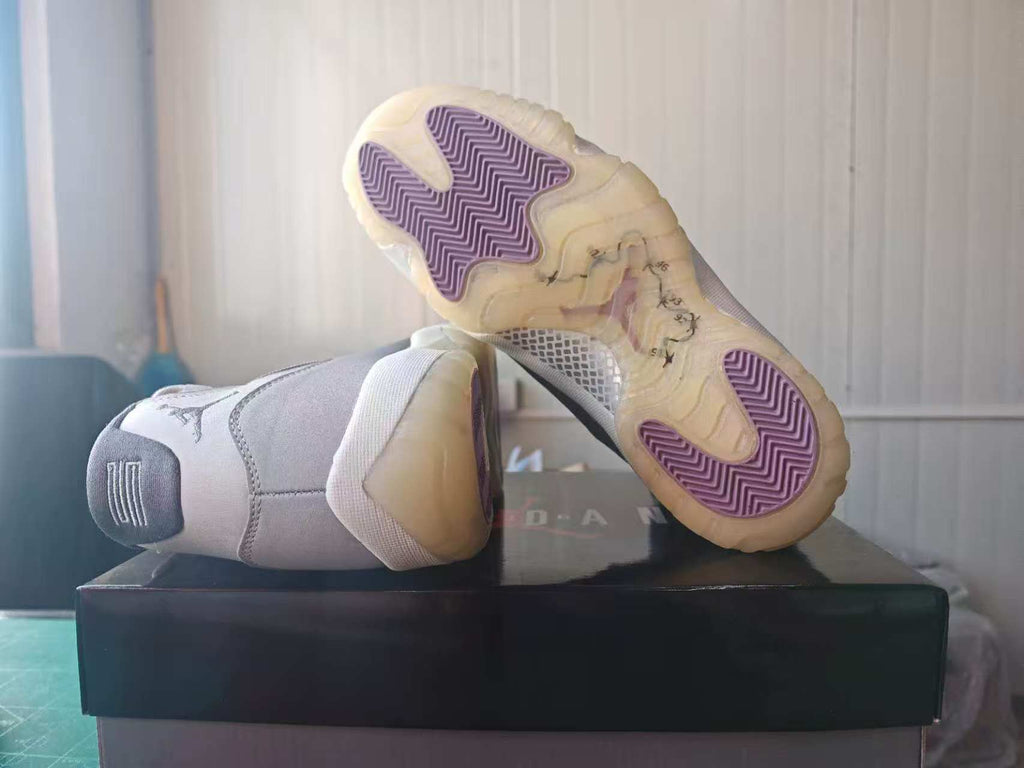 Air Jordan 11 Gray High-Top Sneakers with Purple Sole Details