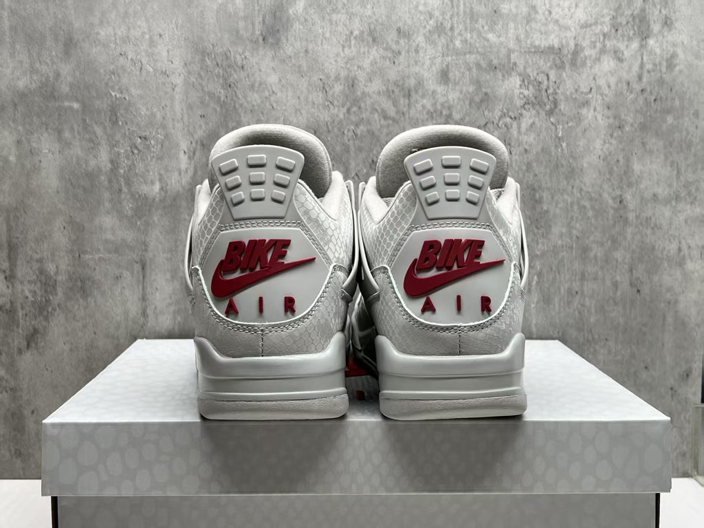 Nigel Sylvester x Air Jordan 4 Gray Sneakers with Red Accents
