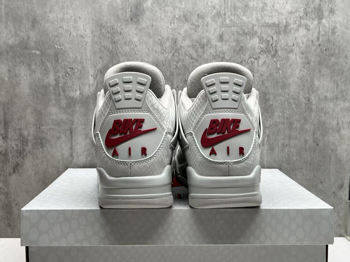 Nigel Sylvester x Air Jordan 4 Gray Sneakers with Red Accents