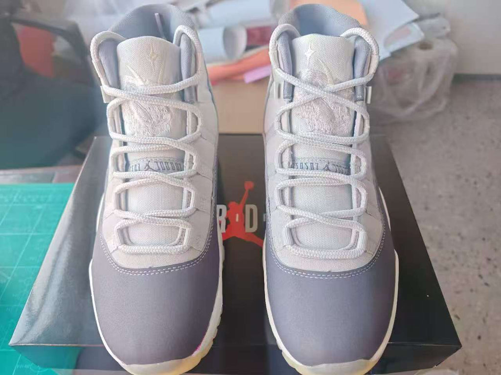 Air Jordan 11 Gray High-Top Sneakers with Purple Sole Details