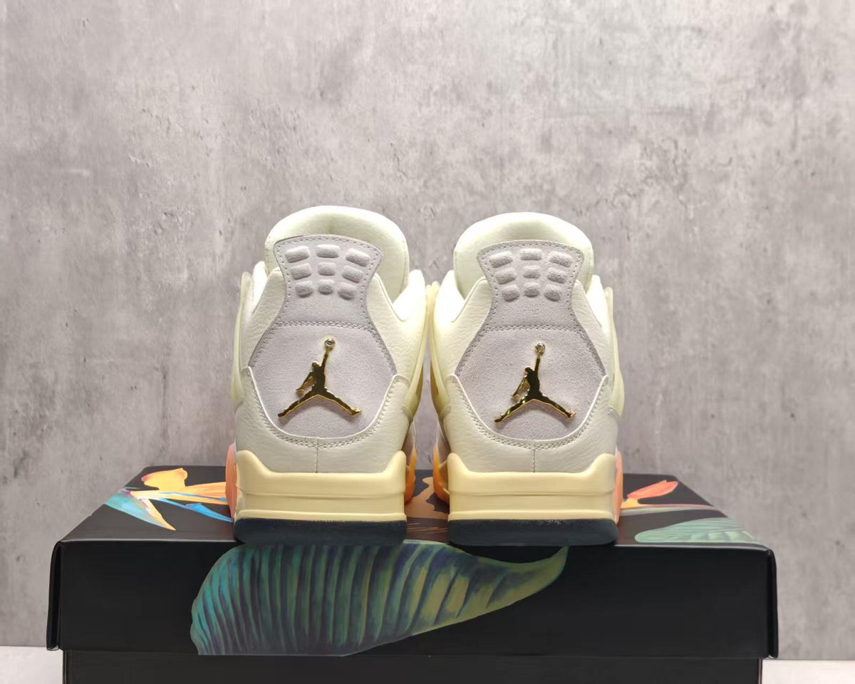 Air Jordan 4 Cream & Grey Sneakers with Orange Accents